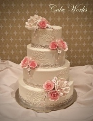 Scroll Pattern on Buttercream with Pink Sugar Flowers